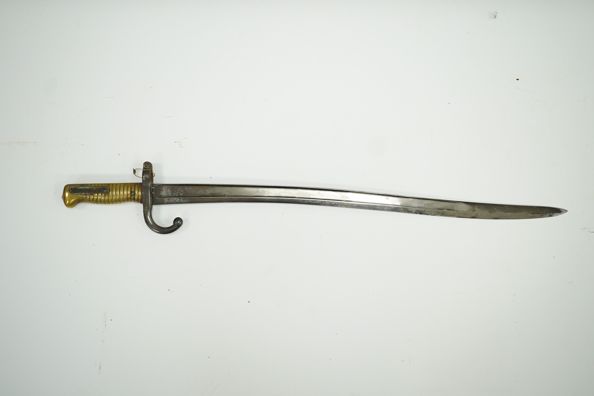 A French bayonet for a chassepot rifle, regulation blade dated 1871 and regulation hilt, in its iron scabbard. Condition - fair